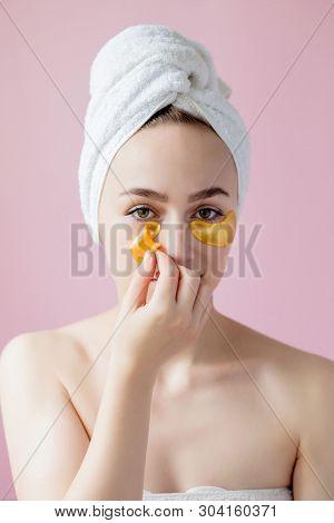 Portrait Of Beauty Woman With Eye Patches On Pink Background. Woman Beauty Face With Mask Under Eyes