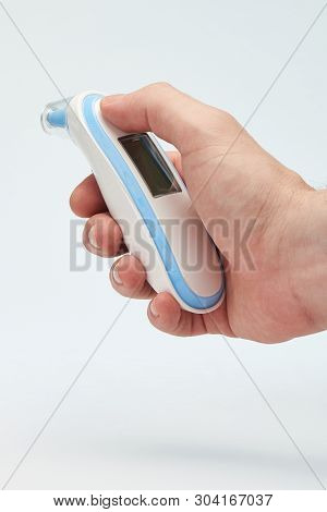 Infared Modern Thermometer In Hand Close Up View Isolated On White Background
