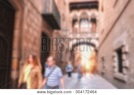 Blurred Background Image Of People Walking On A Street Along Ancient Vintage Architecture In An Old 