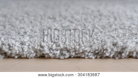 Dolly shot of grey carpet at home