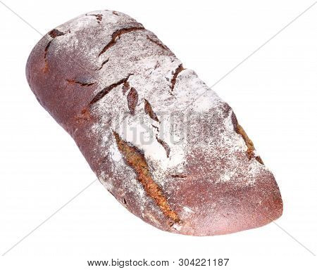 Dark Bread On White Background At Dry Sunny Summer Day