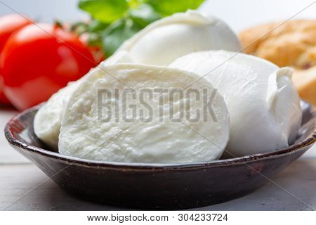 Balls And Pieces Of Buffalo Mozzarella, Soft Italian Scheese Made From The Milk Of Italian Mediterra