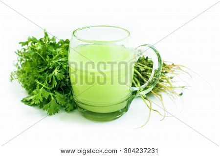 Fresh Parsley Juice  Or Coriander Juice In A Transparent Glass Isolated On White With Fresh Parsley