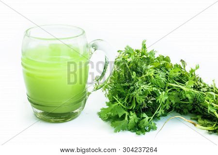 Fresh Parsley Juice  Or Coriander Juice In A Transparent Glass Isolated On White With Fresh Parsley
