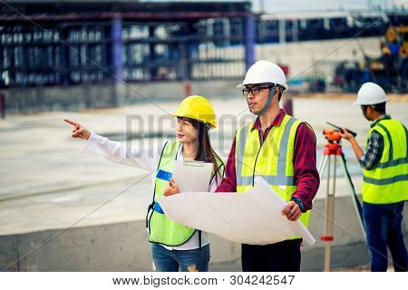 surveyor engineer with theodolite at construction site during surveying work.engineer and architect 