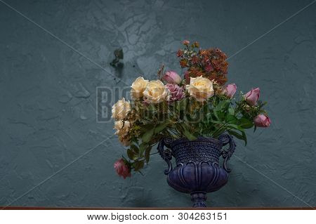 Beautiful And Stylish Artificial Flowers On A Blue Background