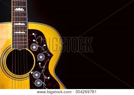 Musical Instrument Wood Acoustic Six-string Guitar Isolated On Blackbackground
