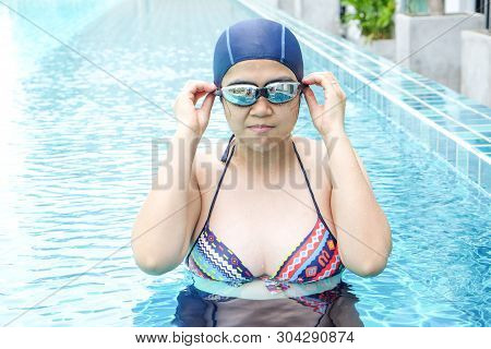 Pregnant Women Exercise Swimming In Pool