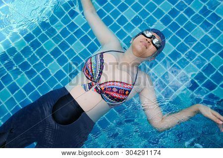 Pregnant Women Exercise Swimming In Pool