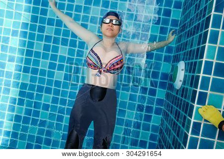Pregnant Women Exercise Swimming In Pool