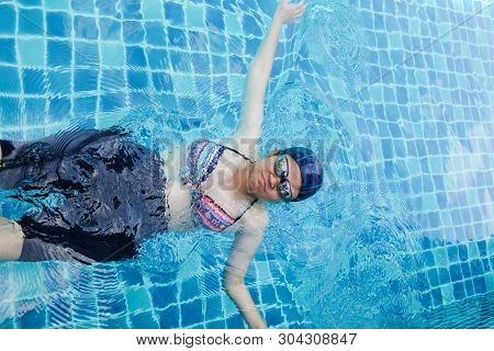 Pregnant Women Exercise Swimming In Pool