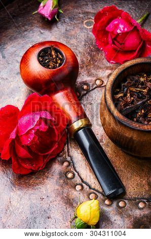 Smoking Pipe And Floral Tobacco