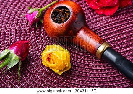 Smoking Pipe And Floral Tobacco
