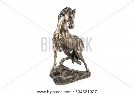 Statuette Of A Bronze Horse With A Raised Leg On A Stand Isolated On White Background
