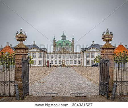 Fredensborg, Denmark - May 18, 2019: Fredensborg Palace Is A Palace Located On The Eastern Shore Of 