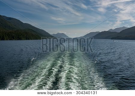 The View From The Back Of A Ferry As It Makes Its Way Through The Inside Passage Off The Rugged West