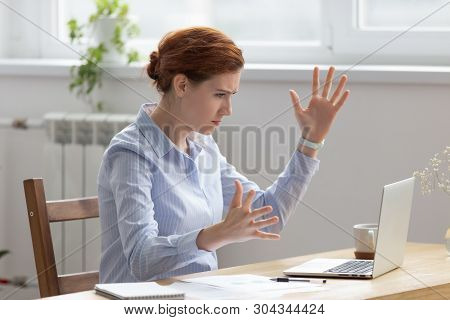 Angry Upset Businesswoman Looking At Laptop Screen Gesturing With Irritation