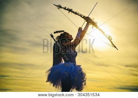 Teen Angel. Teen Angel Girl Archer On Sunset. Silhouette Of A Cupid. Side View Of Teen Girl Archer A