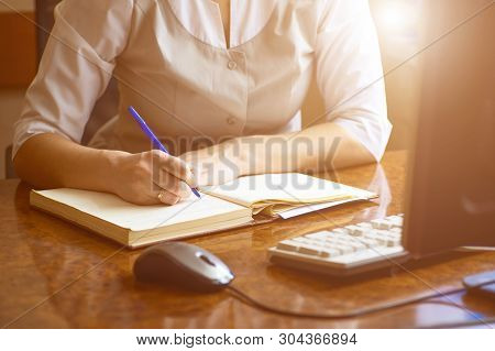 Doctor Woman Writes In The Diary Of Current Affairs In The Dental Clinic