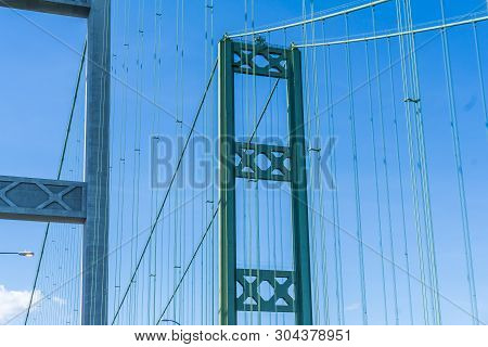 A View Of The Top Of The Narrows Suspension Bridge In Tacoma, Wa.