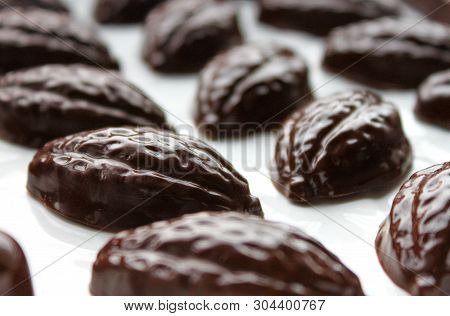 Dark Chocolate Pralines, Molded Handmade Bonbons, Chocolates In Cocoa Bob Shape.