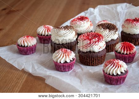 Chocolate Cupcakes With Cream Cheese Frosting, Decorated With Cocoa And Dried Strawberry Powder.