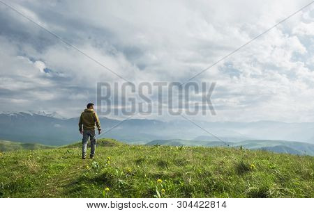 Beautiful Landscape, Man Standing On The Hill In Front Of Mountains
