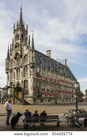 Gouda, Holland, Netherlands, April 23, 2019 - Mediaval Gothic City Hall In The Center Of Old Town Sq