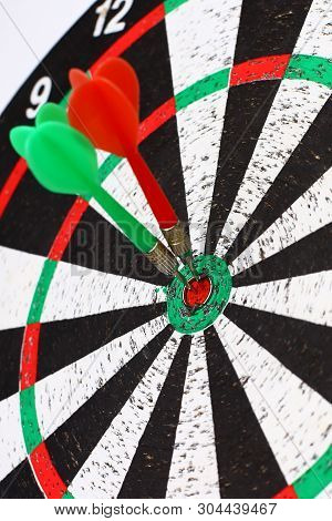 Closeup. Several Arrows Dart Hitting The Center Of The Target D