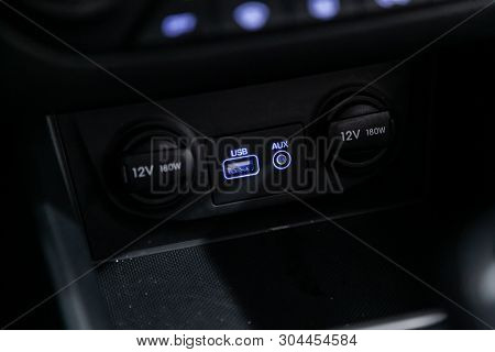 Сlose-up Of The Car  Black Interior:  Power Outlet 12v, Usb, Aux And Other Buttons.
