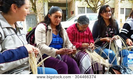 Cuenca, Ecuador - May 5, 2019: Women  Demonstrate Weaving Of Panama Hat Or Paja Toquilla Hat At Craf