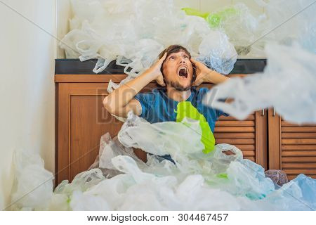 The Man Used Too Many Plastic Bags That They Filled Up The Entire Kitchen. Zero Waste Concept. The C