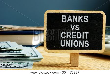 Banks Vs Credit Unions Concept. Money And Ledger.