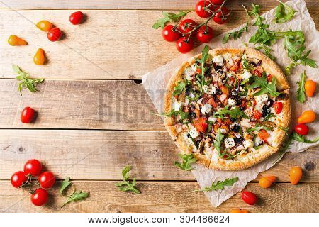 Vegetable Italian Pizza With Tomatos On Wodeen Background, Copy Space, Top View