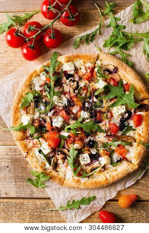 Vegetable Italian Pizza With Tomatos On Wodeen Background, Copy Space, Top View, Vertical