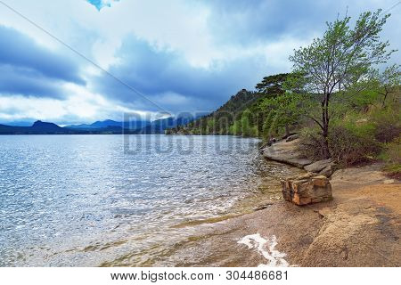 Weather On Lake Borovoe In The National Nature Park Burabai In Kazakhstan. Shore Of Lake Borovoe.