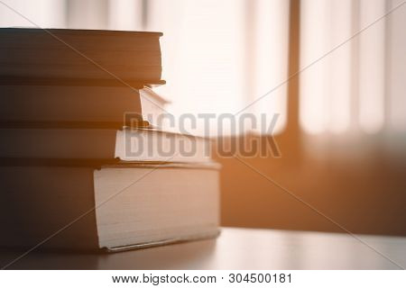 Book In Library.book Stack On Wood Desk.ducation Background, Back To School Concept.