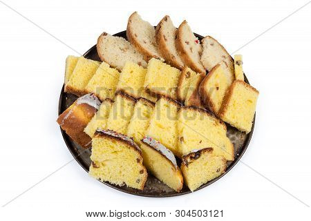 Slices Of Easter Cakes Prepared For Making Sweet Rusks On The Round Baking Tray On A White Backgroun