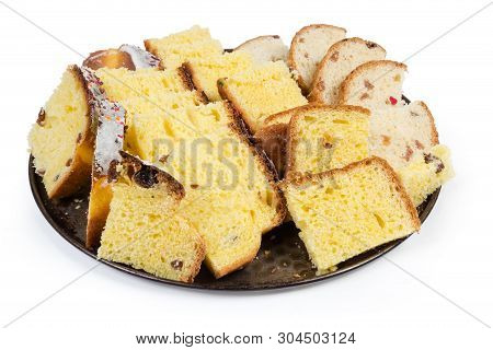Slices Of Easter Cakes Prepared For Making Sweet Rusks On The Round Baking Tray On A White Backgroun