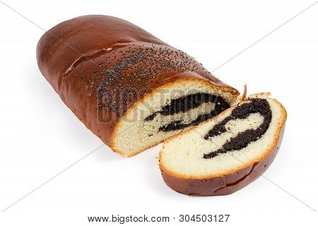 Piece And Slice Of The Pie With Sweet Crushed Poppy Seed Filling And Sprinkled With Whole Poppy Seed