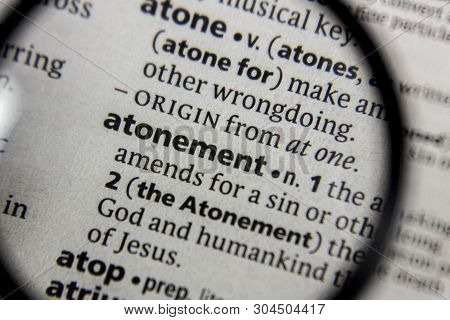 The Word Or Phrase Atonement In A Dictionary Book.