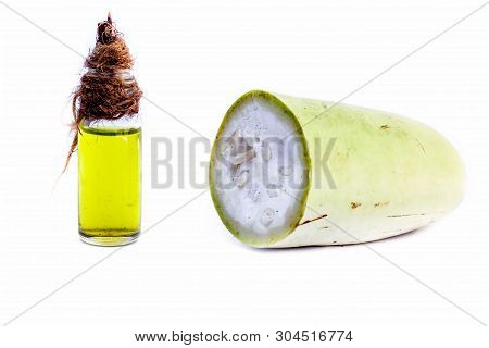 Raw Organic Cut Half Bottle Gourd Isolated On White Along With Its Extracted Beneficial Oil In A Sma