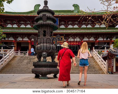 Nanshan Cultural Park, Hainan, China - 5 Mar 2019 - Two Caucasian Female Tourists Visit Nanshan Temp
