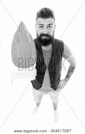 Heat Up Iron. Man Bearded Hipster Hold Electric Ironing Tool. How To Iron Clothes Correctly. Be Care
