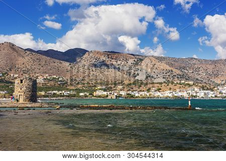 Old Windmills Poros Elounda at Spinalonga Peninsula near the town of Elounda, Island of Crete - Greece