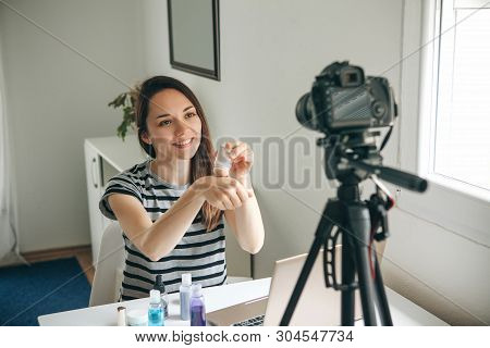 A Beauty Blogger Or Video Blogger Tells And Shows Subscribers How To Do Makeup.