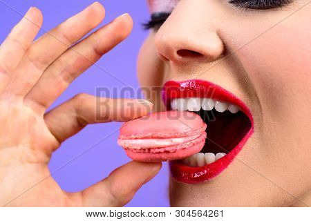 Sweet Meringue-based Confection. Woman With Delicacy Macaroon. Pastry Macaroon. Girl Eat Tasty Macar