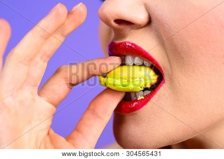 Traditional French Colorful Macaroons. Sweet Meringue-based Confection. Woman With Delicacy Macaroon