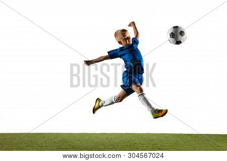 Young Boy As A Soccer Or Football Player In Sportwear Making A Feint Or A Kick With The Ball For A G