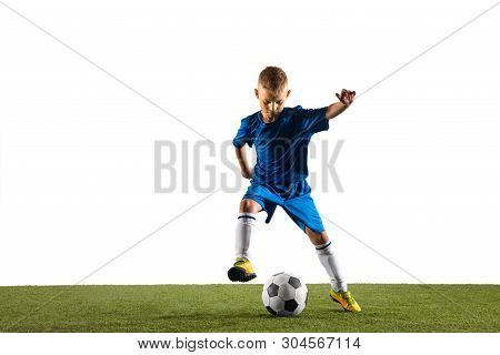 Young Boy As A Soccer Or Football Player In Sportwear Making A Feint Or A Kick With The Ball For A G